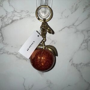 COACH The Summer I Turned Pretty Peach Bag Charm